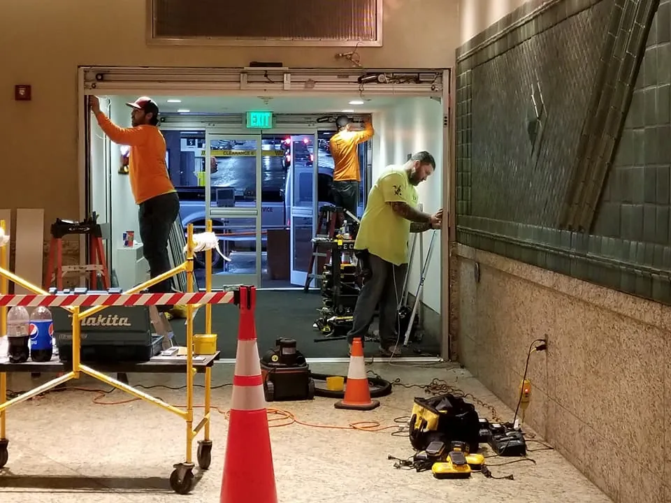 M1-TEX crew working a commercial storefront build-out