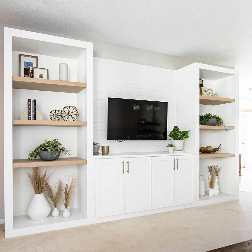 White built-in media shelving and cabinets