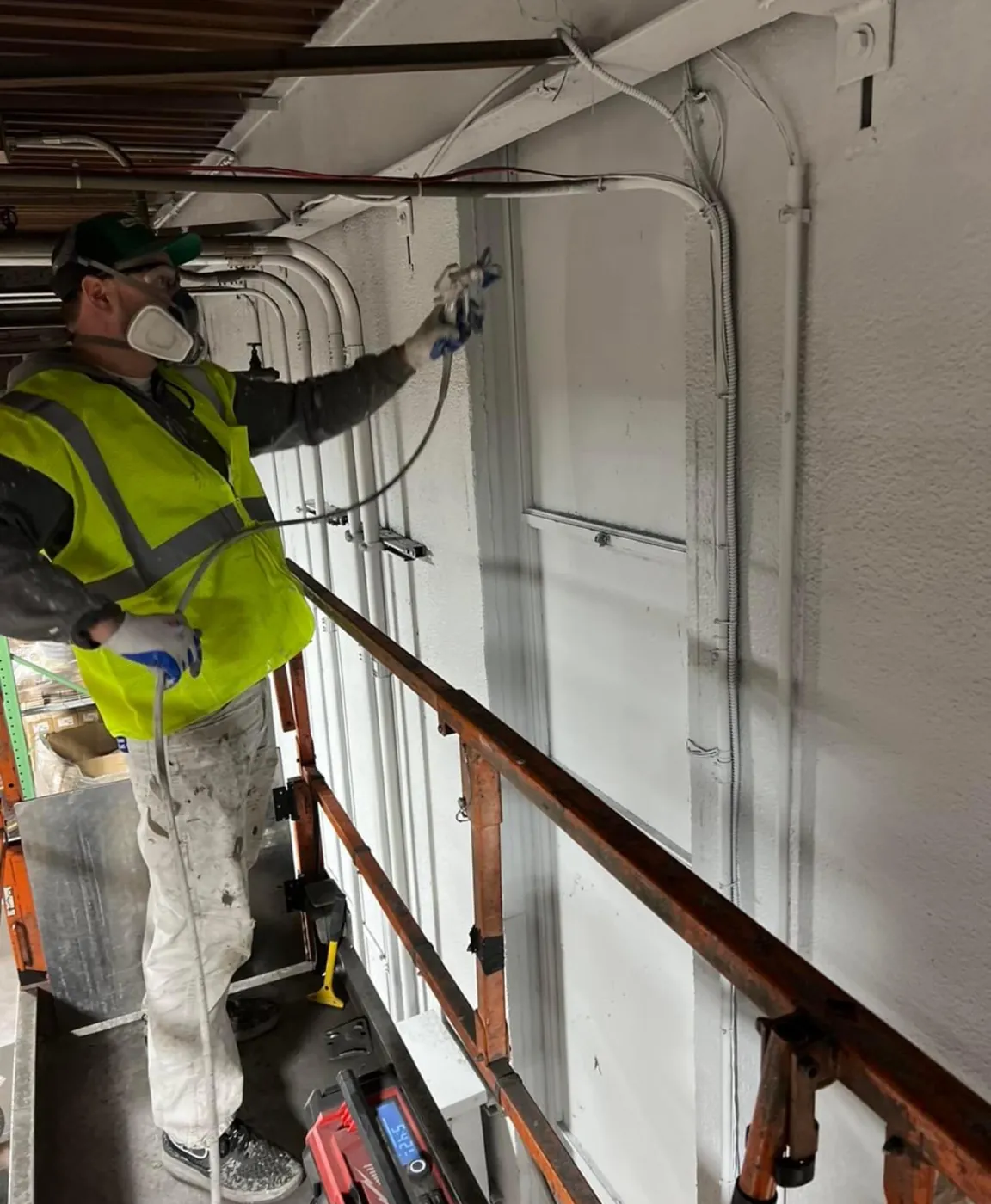 M1-TEX crew member working a commercial mechanical install
