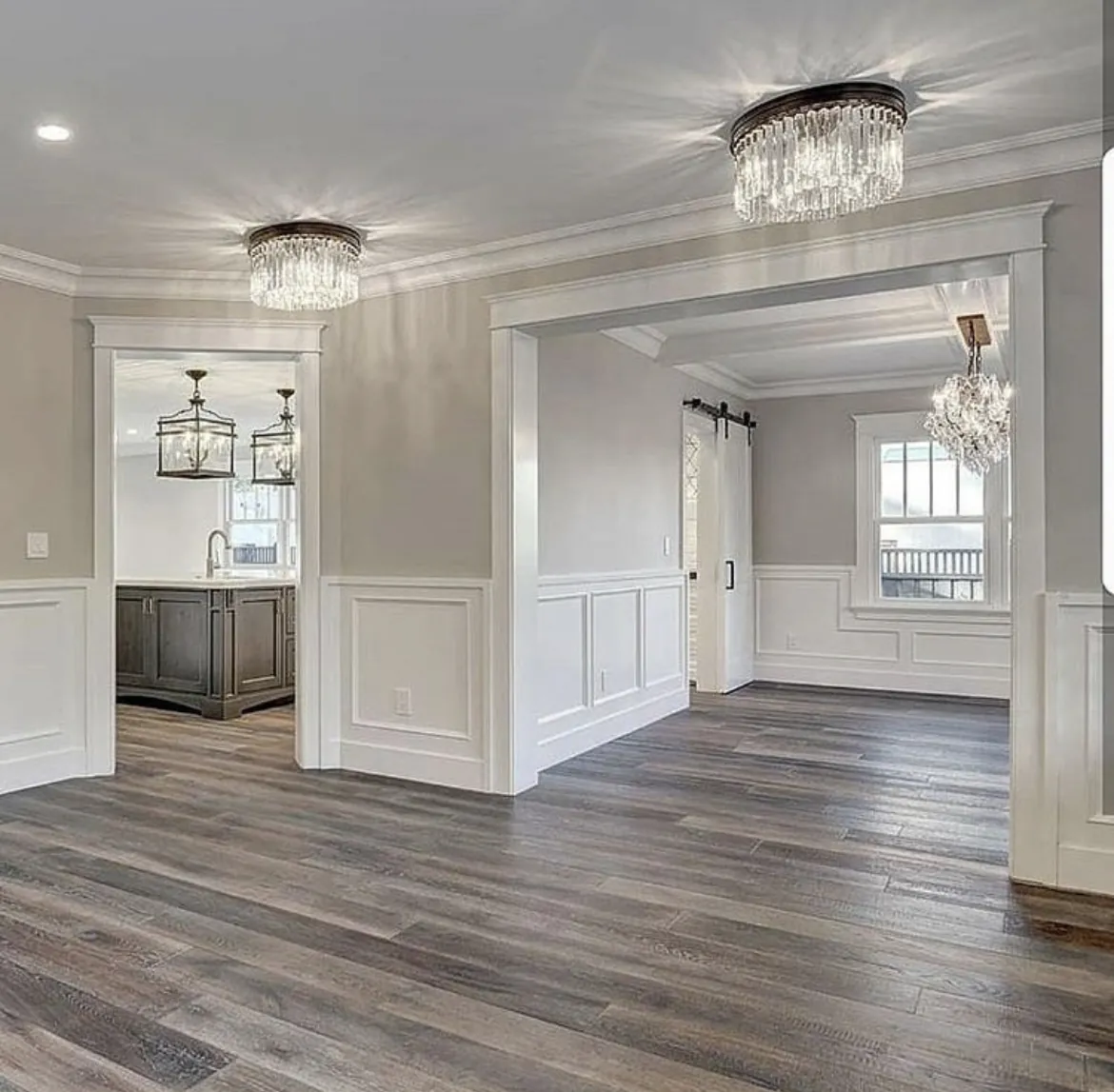 Formal dining and entry with wainscoting and new flooring