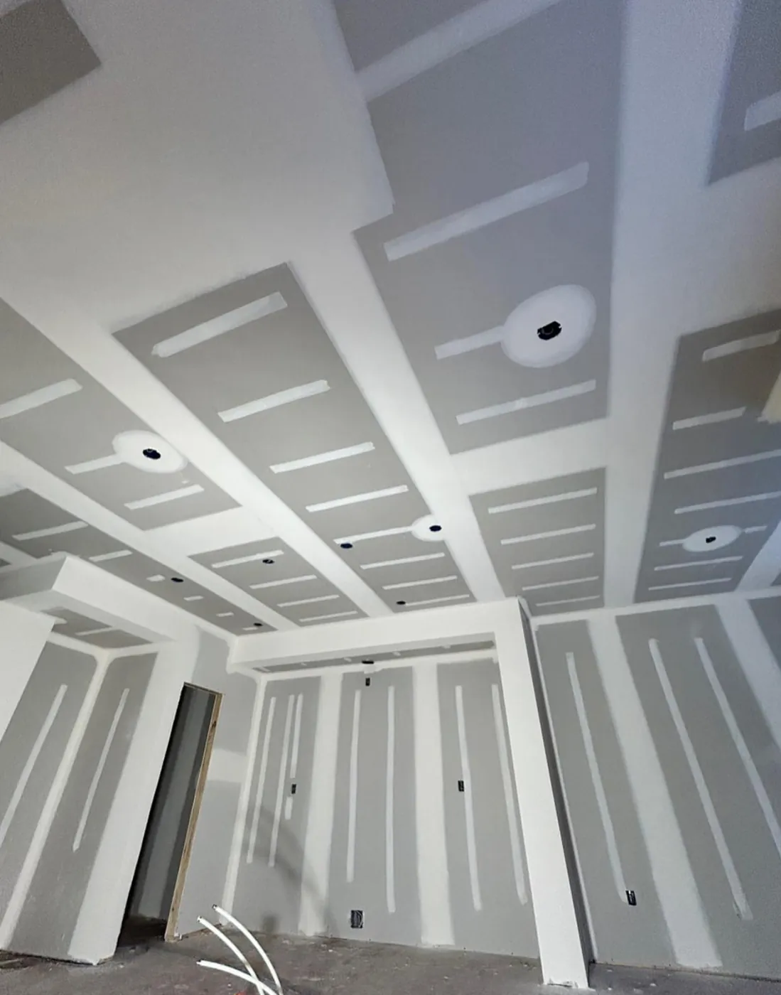 Drywall and framing in progress during a remodel